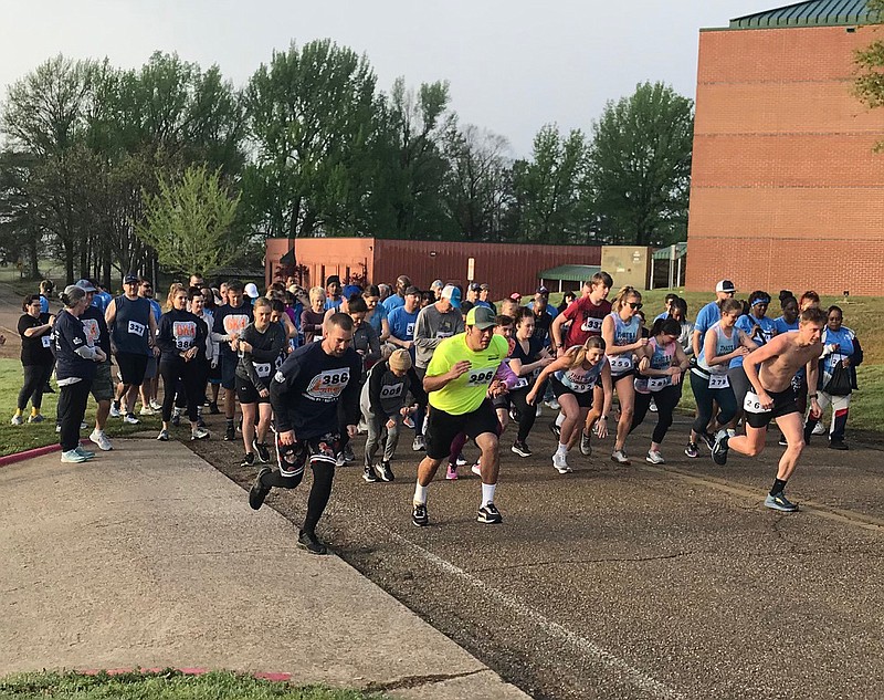 About 120 members of Fellowship Bible Church take off during the fifth annual 6K4WATER run/walk Saturday morning, March 25, 2023, in Texarkana, Texas. The race raises money for Watermission.org, which digs water wells in developing countries. (Staff photo by Greg Bischof)