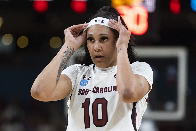South Carolina's Kamilla Cardoso (10) adjust her headband duringin the first half of a Sweet 16 college basketball game  against UCLA at the NCAA Tournament in Greenville, S.C., Saturday, March 25, 2023. (AP Photo/Mic Smith)