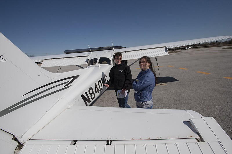 Flight instructor Miles Manning (left) shows student Skyler Sneed of Bella Vista how to perform a preflight check March 17 at the Bentonville Airport/Thaden Field. Visit nwaonline.com/photo for today’s photo gallery.

(NWA Democrat-Gazette/J.T. Wampler)