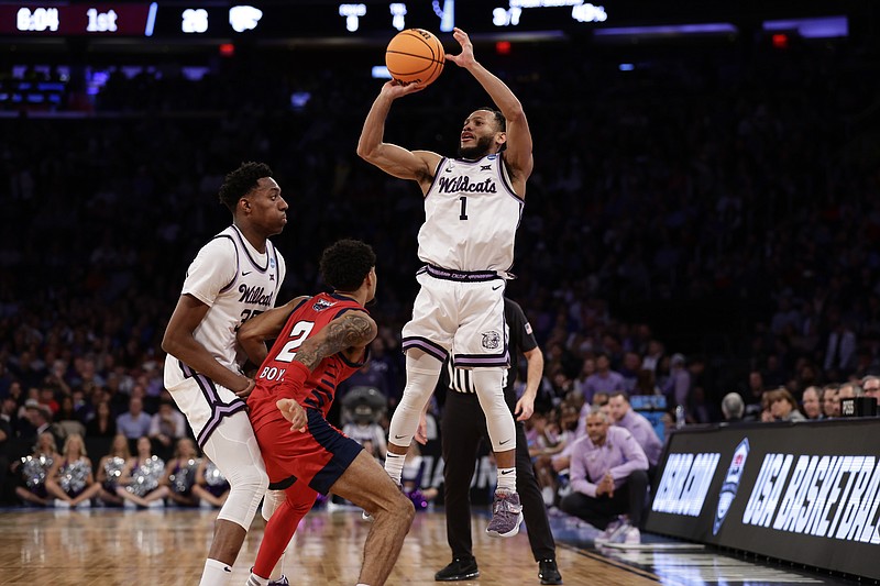 Kansas State's Markquis Nowell (1) shoots in the first half of an Elite 8 college basketball game against Florida Atlantic in the NCAA Tournament's East Region final, Saturday, March 25, 2023, in New York. (AP Photo/Adam Hunger)