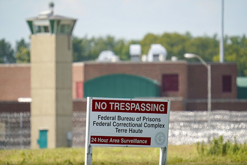 FILE - This Aug. 26, 2020 file photo shows the federal prison complex in Terre Haute, Ind. Rejon Taylor hoped the election of Joe Biden, the first U.S. president to campaign on a pledge to end the death penalty, would mean a more sympathetic look at his claims that racial bias and other trial errors landed him on federal death row in Terre Haute, Ind. An Associated Press review of dozens of legal filings shows that President Biden&#x2019;s Justice Department is fighting just as vigorously as Donald Trump's did to uphold death row inmates' sentences, despite Biden's opposition to capital punishment. (AP Photo/Michael Conroy, file)