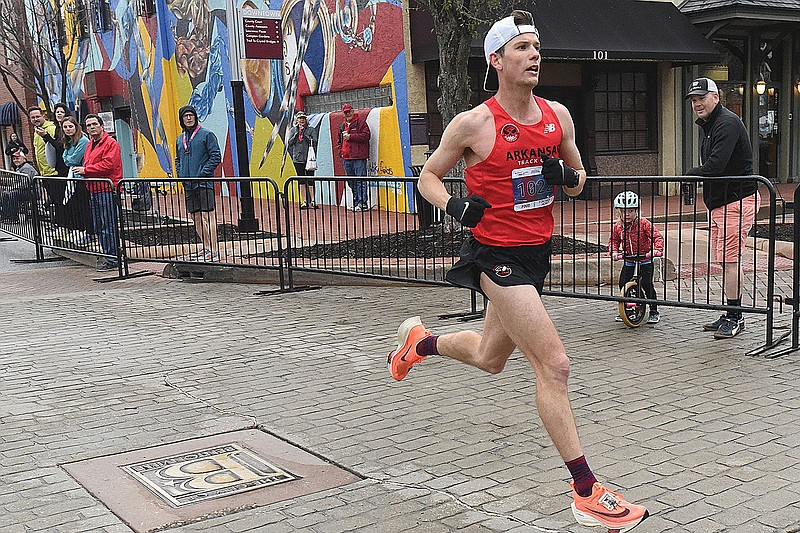 Cameron Beckett of Little Rock sprints to the finish April 2 to win the 2022 Bentonville Half Marathon.
(File Photo/NWA Democrat-Gazette/Flip Putthoff)