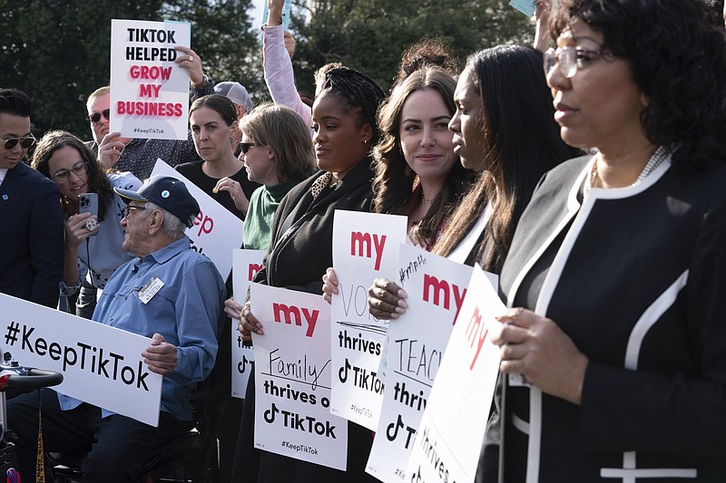 Supporters of TikTok hold signs during a rally to defend the app, Wednesday, March 22, 2023, at the Capitol in Washington. The House holds a hearing Thursday, with TikTok CEO Shou Zi Chew about the platform's consumer privacy and data security practices and impact on kids. (AP Photo/Jose Luis Magana)