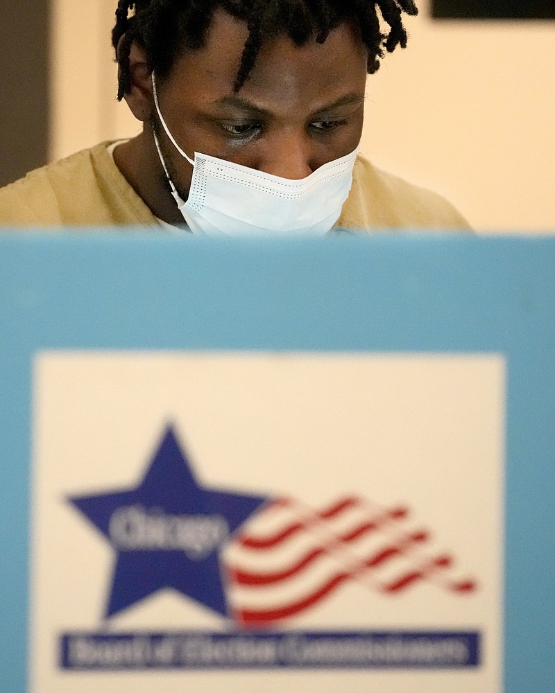 Tykarri Skillon, an inmate at the Cook County, Ill., jail votes in a local election at the jail's Division 11 Chapel on Saturday, Feb. 18, 2023, in Chicago. (AP Photo/Charles Rex Arbogast)