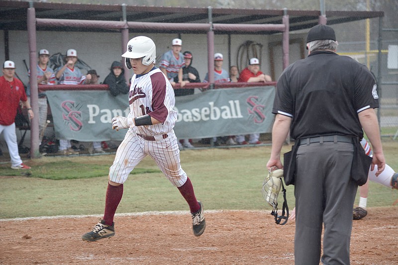 Graham Thomas/Herald-Leader
Siloam Springs' Braxton Majors crosses home for a run against Heber Springs on March 23.