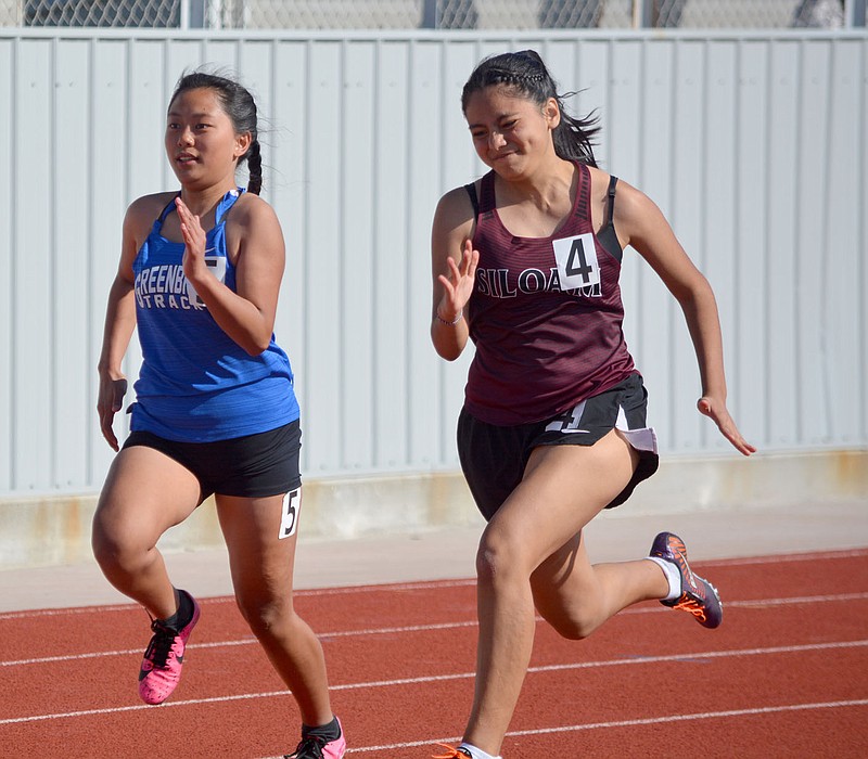 Graham Thomas/Herald-Leader
Anahi Quinonez runs the 100 meter dash at the 5A-West Conference Meet last spring. Siloam Springs hosts the annual Panther Relays on Thursday at Glenn W. Black Stadium.