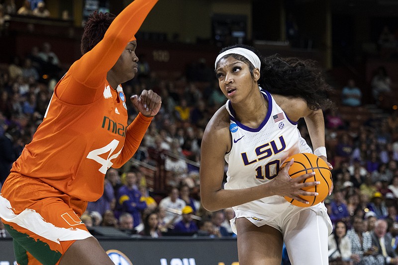 LSU's Angel Reese (10) goes up to shoot over Miami's Kyla Oldacre (44) in the first half of an Elite 8 college basketball game of the NCAA Tournament in Greenville, S.C., Sunday, March 26, 2023. (AP Photo/Mic Smith)