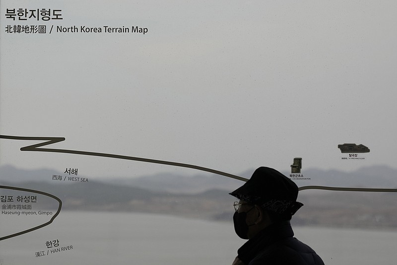 A visitor looks at the North Korean side from the unification observatory in Paju, South Korea, Tuesday, March 14, 2023. South Korea's military said Monday, March 27, 2023, it detected North Korea firing at least one ballistic missile toward the sea off its eastern coast, adding to a recent flurry in weapons tests as the United States steps up its military exercises with the South to counter the North's growing threat.  (AP Photo/Lee Jin-man)