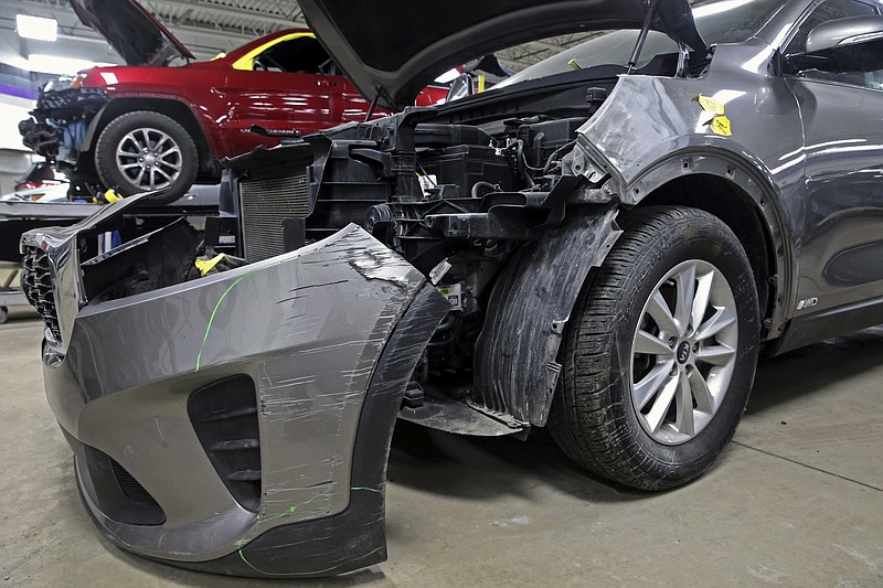 FILE - A Kia that was damaged after being stolen sits at an auto repair shop in Milwaukee on Jan. 27, 2021. The city of St. Louis filed a federal lawsuit Monday, March 27, 2023, against Kia and Hyundai, accusing the automakers of failing to install industry-standard anti-theft technology, resulting in thousands of thefts of vehicles in the Missouri city. (Angela Peterson/Milwaukee Journal-Sentinel via AP, File)