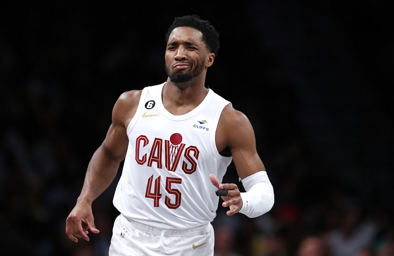 Cleveland Cavaliers guard Donovan Mitchell (45) reacts after making a three point shot against the Brooklyn Nets during the second half of an NBA basketball game, Tuesday, March 21, 2023, in New York. The Cleveland Cavaliers won 115-109. (AP Photo/Noah K. Murray)
