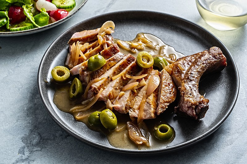 Pork chops meet a dirty martini. (Photo for The Washington Post by Scott Suchman.)