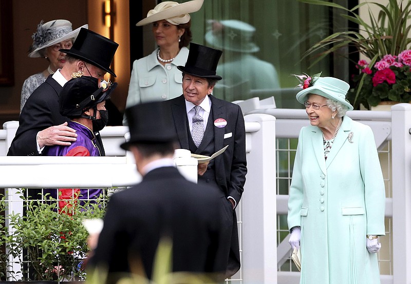 Britain’s Queen Elizabeth II, right, talks to Frankie Dettori, left, and trainer John Gosden, back, left, during day five of the Royal Ascot horserace meeting at Ascot Racecourse in Ascot, England, on June 19, 2021. - Photo by David Davies of The Associated Press