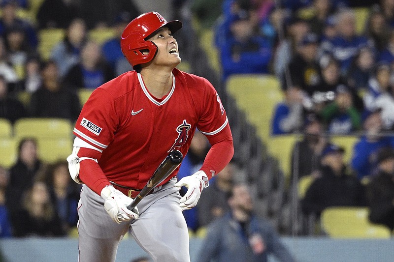 Los Angeles Angels' Shohei Ohtani runs to first as he flies out during the sixth inning of a preseason baseball game against the Los Angeles Dodgers Sunday, in Los Angeles. - Photo by Mark J. Terrill of The Associated Press