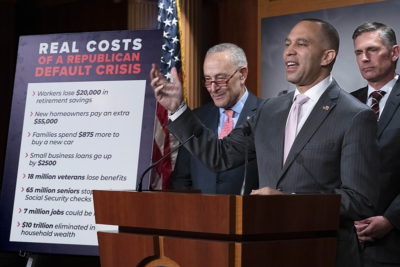 FILE - From left, Senate Majority Leader Chuck Schumer, D-N.Y., House Minority Leader Hakeem Jeffries, D-N.Y., and Sen. Martin Heinrich, D-N.M., talk to reporters about the Joint Economic Committee Report on the Republican Party's debt limit position, at the Capitol in Washington, March 23, 2023. Republican House Speaker Kevin McCarthy says he’s growing increasingly concerned about President Joe Biden’s unwillingness to negotiate on lifting the nation’s borrowing authority. He says in a letter to the president dated Tuesday that the White House position “could prevent America from meeting its obligations and hold dire ramifications for the entire nation.” (AP Photo/J. Scott Applewhite. File)