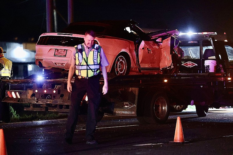 A police officer works the scene of a fatal accident Tuesday night, March 28, 2023, on Interstate 30. The accident was near the two-mile marker at the Four States Fairgrounds exit in the westbound lane, according to the Texarkana Arkansas Police Department. Police are asking motorists to avoid this area. (Photo by JD)