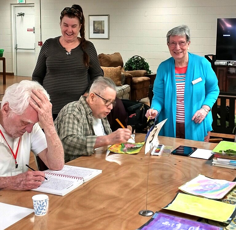Gail McKee and Doreen Wilson, members of Hot Springs Emblem Club No. 194, were at The Caring Place on Monday to help clients do a watercolor craft project. - Submitted photo