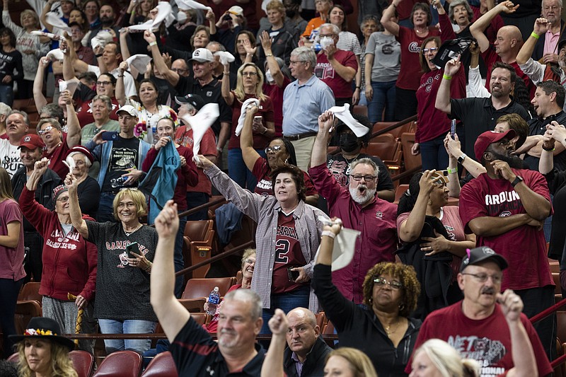 South Carolina fans celebrate after defeating Maryland in the Elite 8 Monday in Greenville, S.C. - Photo by Mic Smith of The Associated Press