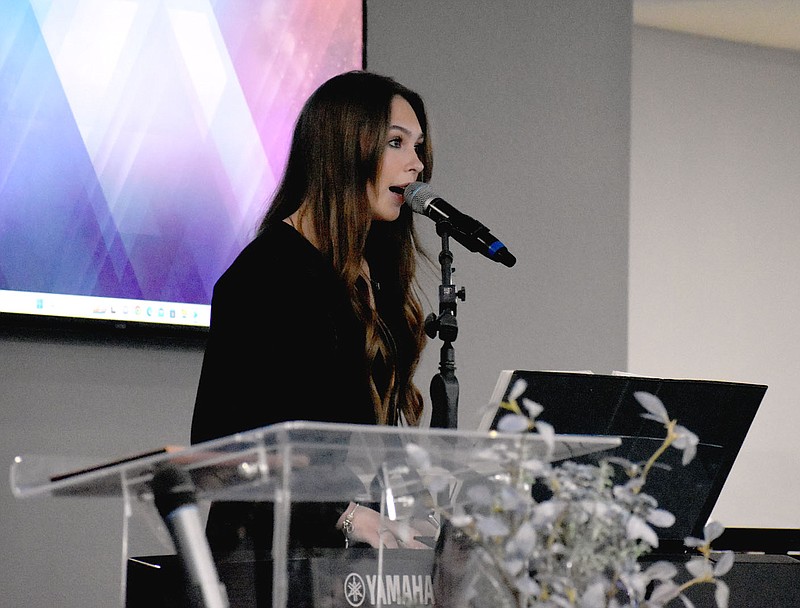 Alyssa McRoy, 15, of Fort Meyers, Fla., sings March 19 during an evening revival service at Lincoln First Assembly of God Church.

(NWA Democrat-Gazette/Mark Humphrey)