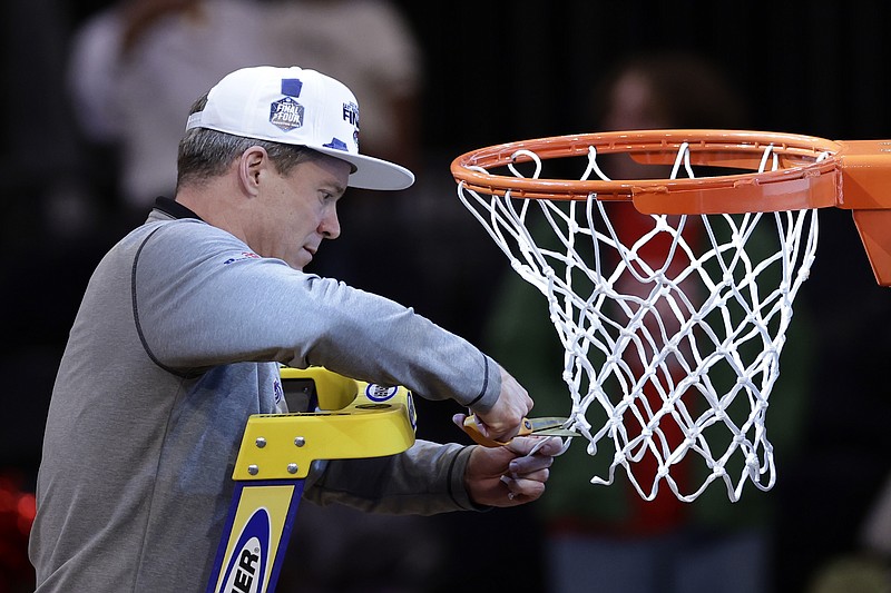 Florida Atlantic head coach Dusty May cuts the net after Florida Atlantic defeated Kansas State in an Elite 8 college basketball game in the NCAA Tournament's East Region final, Saturday, March 25, 2023, in New York. (AP Photo/Adam Hunger)