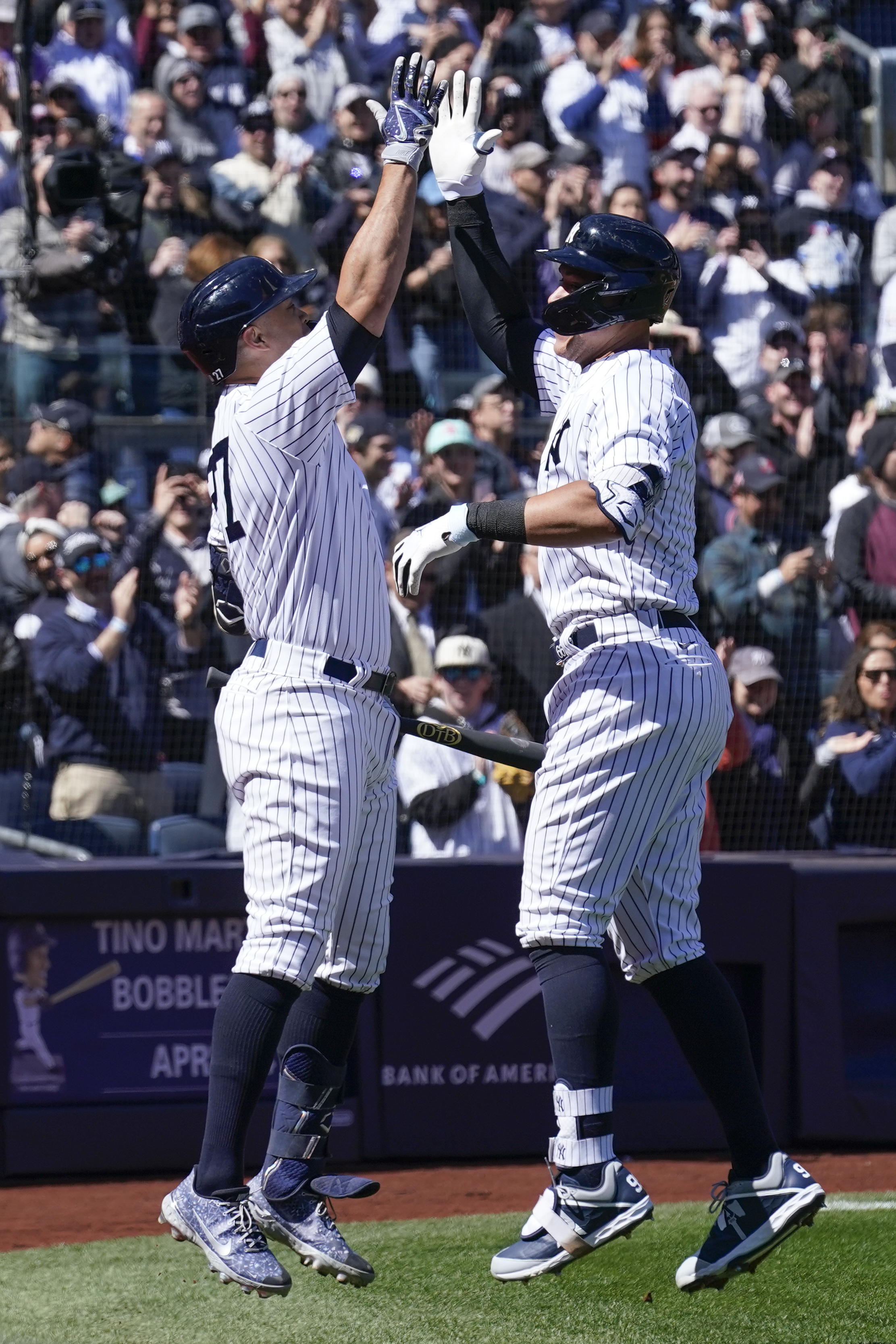 New York Yankees' Giancarlo Stanton (27) celebrates with Aaron