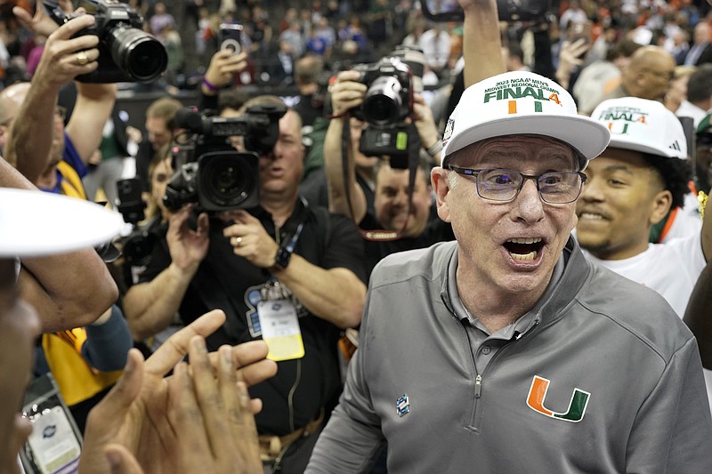 Miami head coach Jim Larranaga celebrates after beating Texas in the Elite 8 Sunday in Kansas City, Mo. - Photo by Charlie Riedel of The Associated Press