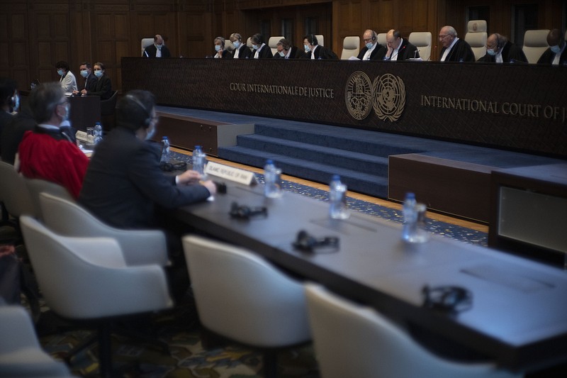 Judge and vice president Kirill Gevorgian of Russia, third from right, starts reading the verdict of The International Court of Justice, the United Nations' top court, which issued its judgment in a dispute between Iran and the United States over frozen Iranian state bank accounts worth some $2 billion, in The Hague, Netherlands, Thursday, March 30, 2023. (AP Photo/Peter Dejong)