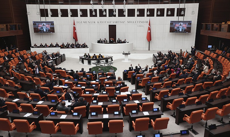 Turkish lawmakers vote in favor of Finland's bid to join NATO, late Thursday, March 30, 2023, at the parliament in Ankara, Turkey. All 276 lawmakers present voted unanimously in favor of Finland's bid, days after Hungary's parliament also endorsed Helsinki's accession.(AP Photo/Burhan Ozbilici)
