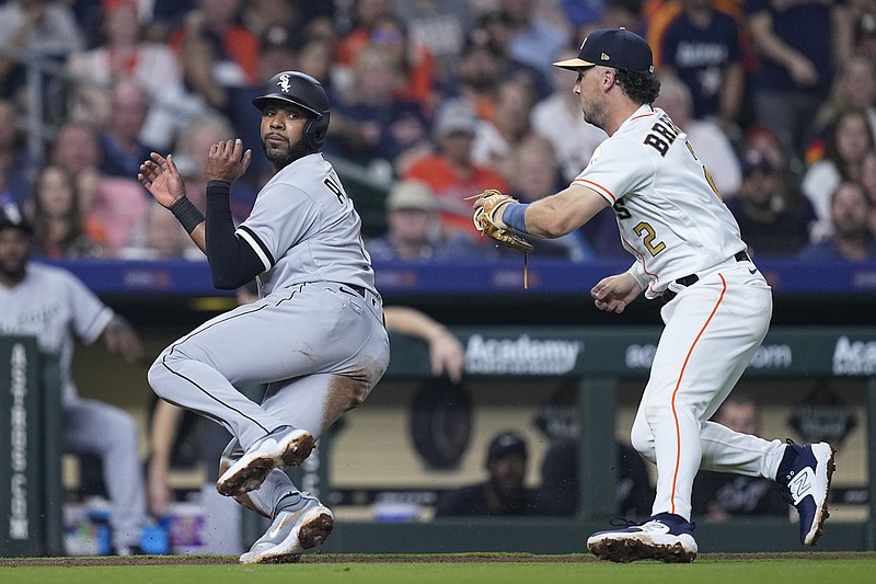 Chicago White Sox's Elvis Andrus is caught in a rundown by Houston Astros third baseman Alex Bregman during the fifth inning of a baseball game Thursday, March 30, 2023, in Houston. (AP Photo/Kevin M. Cox)