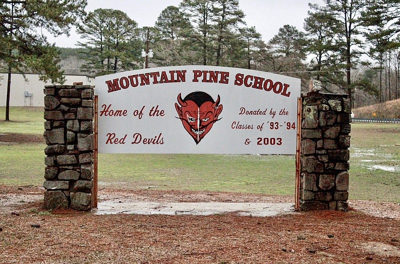 The Mountain Pine School sign is shown in early March in front of the high school campus. - File photo by Lance Porter of The Sentinel-Record
