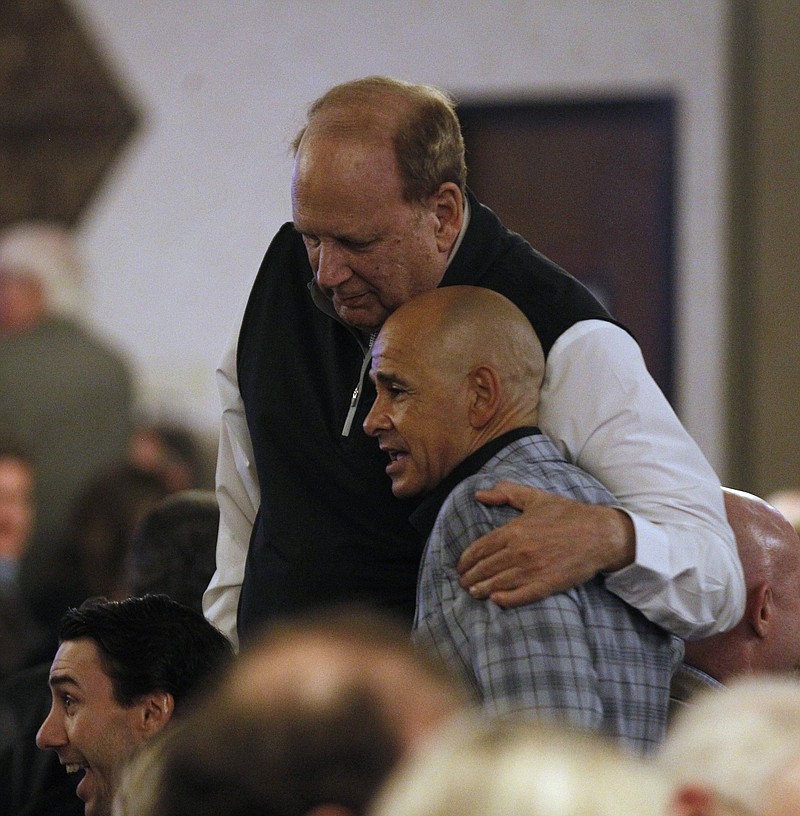 Jockey Mike Smith gets a hug from Frank Fletcher before the 13th Annual Oaklawn Jockey Club Kick-Off Banquet on Jan. 15, 2020, at the Wyndham Hotel in North Little Rock. - Photo by Thomas Metthe of Arkansas Democrat-Gazette