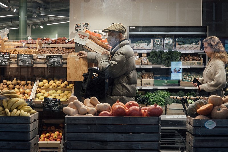 Customers shop for groceries inside a grocery store in Paris, France, on Monday, Jan. 2, 2023. Insee said France's inflation will continue to advance, peak in January and remain above 5% throughout the first half of the year. MUST CREDIT: Bloomberg photo by Cyril Marcilhacy