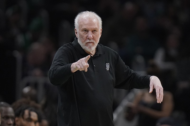 FILE - San Antonio Spurs head coach Gregg Popovich points from the bench in the second half of an NBA basketball game against the Boston Celtics, Sunday, March 26, 2023, in Boston. The Naismith Memorial Basketball Hall of Fame made it all official on Saturday, April 1, 2023 with three of the NBA’s all-time international greats — Dirk Nowitzki, Tony Parker and Pau Gasol — joining Dwyane Wade, Becky Hammon and  Popovich as the headliners of the 2023 class that will be enshrined on Aug. 11 and 12 at ceremonies in Connecticut and Massachusetts.(AP Photo/Steven Senne, File)