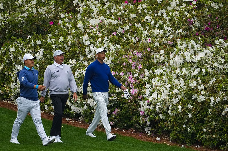 Si Woo Kim, of South Korea,, Fred Couples and Tiger Woods from left walk on the 13th fairway during a practice for the Masters golf tournament at Augusta National Golf Club, Monday, April 3, 2023, in Augusta, Ga. (AP Photo/Matt Slocum)