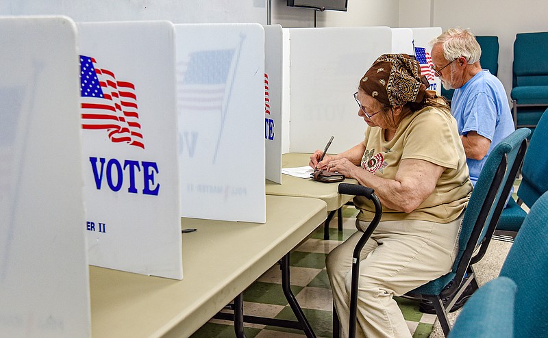 Tuesday was voting day and  Marilyn and Dennis Tackett showed up at Ward 2/Precinct 3 at Capital City Christian Church to cast their ballots. At the time they voted, they were the only two voters in the room. The pace was slow but turnout was relatively steady, be it one or two at a time at this location. Cole County Clerk Steve Korsmeyer predicted a 12 percent turnout and some judges said that they would be really happy if their count did reach that level. (Julie Smith/News Tribune)