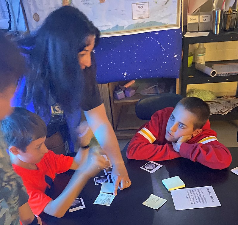 Adam Reider/Fulton Sun
Left to Right: Noah Devers, Landon Jones and Chase Spencer try to solve a math puzzle in South Callaway Elementary School teacher Manda Wilmsmeyer's space-themed transformation room.