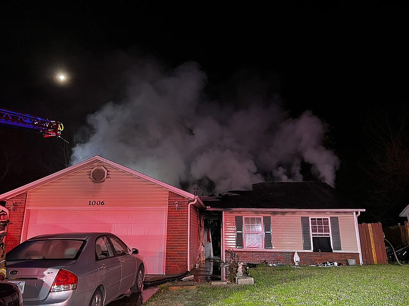 Smoke rises from a home on South D Street in Rogers after firefighters responded to a fire there on Thursday, April 6, 2023.
COURTESY OF ROGERS FIRE DEPARTMENT