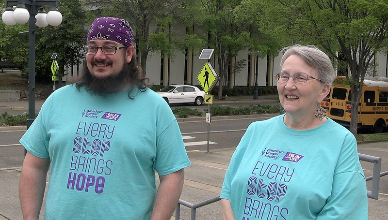 Adrian Perry, left, and Brenda Plummer discuss the upcoming Garland County Relay For Life event on April 14. – Photo by Courtney Edwards of The Sentinel-Record