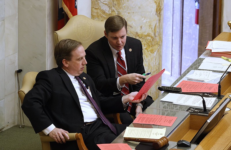 Speaker of the House Matthew Shepherd, left talks with Rep. Jimmy Gazaway, R-Paragould, before the House session returned from a recess on Thursday, April 6, 2023, at the state Capitol in Little Rock. (Arkansas Democrat-Gazette/Thomas Metthe)
