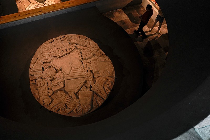 A monolith depicting Coyolxauhqui is exhibited at the Museum of Templo Mayor, marking the 45th anniversary of the circular stones discovery, in Mexico City, Wednesday, March 29, 2023. “Coyolxauhqui: The star, the goddess, the discovery” exhibition displays more than 150 archaeological objects focused on the mythology, symbolism and scientific research around the Mexica lunar goddess. (AP Photo/Eduardo Verdugo)