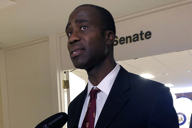 FILE - Dr. Joseph Ladapo speaks with reporters after the Florida Senate confirmed his appointment as the state's surgeon general on Feb. 23, 2022, in Tallahassee, Fla. An analysis that was the basis of a highly criticized recommendation from Floridas surgeon general cautioning young men against getting the COVID-19 vaccine omitted information that showed catching the virus could increase the risk of a cardiac-related death much more than getting the shot. That's according to drafts of the analysis obtained by the Tampa Bay Times.  (AP Photo/Brendan Farrington, File)