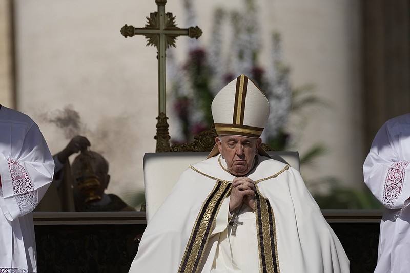 Pope Francis sits on the altar in St. Peter's Square at The Vatican during the Easter Sunday mass, Sunday, April 9, 2023. (AP Photo/Alessandra Tarantino)