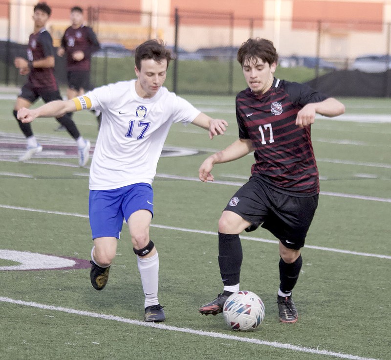 Mark Ross/Special to the Herald-Leader
Siloam Springs' Dylan Garcia (right) and Harrison's Will Mahoney battle for the ball during Thursday's game at Panther Stadium. Harrison won the game 3-1.