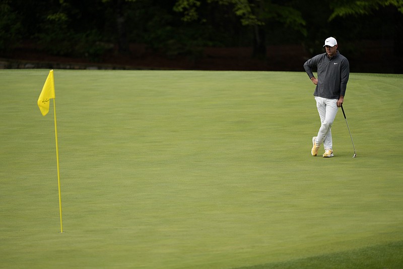 Jon Rahm kisses wife Kelley Cahill after winning 2023 Masters