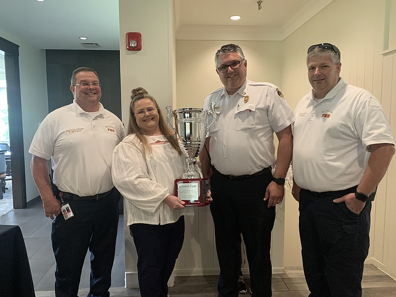 Debbie Lewis, administrative assistant at the El Dorado Fire Department, holds the Administrative Professional of the Year trophy after the 2022 Admin Professional Luncheon. Pictured with her, from left, are EFD Deputy Chief Sean McCall, Chief Chad Mosby and Fire Marshal Jason Evans. Nominations for the 2023 Administrative Professional of the Year are due Friday. (Courtesy of the El Dorado-Union County Chamber of Commerce)