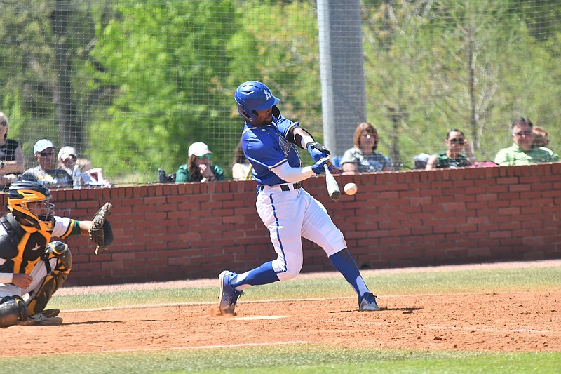 Southern Arkansas University's Chris Lyles smashes the ball against Arkansas Tech on Saturday in a Great American Conference baseball game.  (Photo by Kevin Sutton)