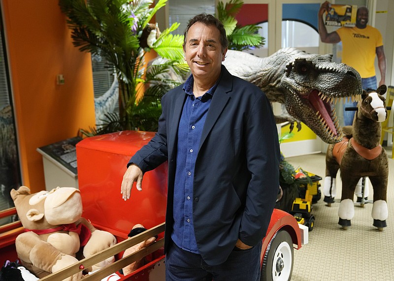 Jay Foreman, CEO of Basic Fun!, stands inside his toy company, Thursday, April 6, 2023, in Boca Raton, Fla. Foreman had to temporarily scuttle plans for an acquisition due to the credit crunch. (AP Photo/Marta Lavandier)