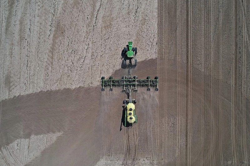 Heavy farming equipment is used to work on a field south of Kerr on Tuesday, April 11, 2023. (Arkansas Democrat-Gazette/Colin Murphey)