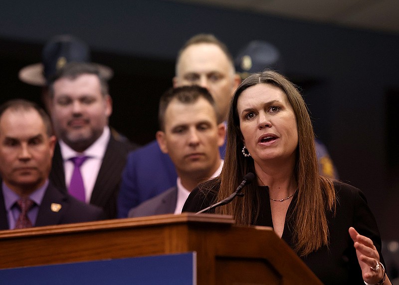 Gov. Sarah Huckabee Sanders speaks during a press conference at the Arkansas State Police Headquarters where she signed the Protect Arkansas Act on Tuesday, April 11, 2023. (Arkansas Democrat-Gazette/Colin Murphey)