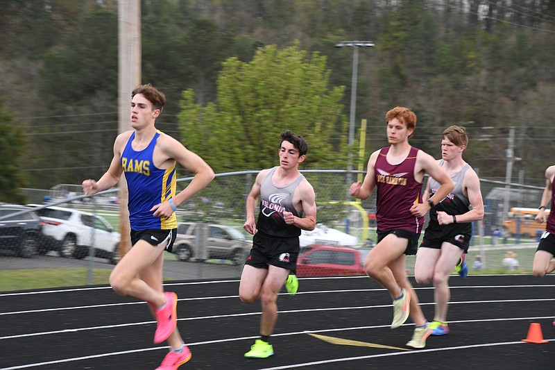 Lakeside’s Joseph Bariola leads a race while Lake Hamilton’s Nathan Miller trails April 6. at the Lakeside Ram Relays. - Photo by Lance Brownfield of The Sentinel-Record