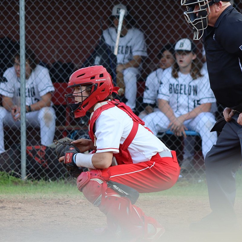 Mountain Pine junior catcher Jonah Wilburn prepares to receive a pitch in a baseball game against Bigelow on April 3. The Red Devils lost 13-2 on the road to the Panthers. - Submitted photo